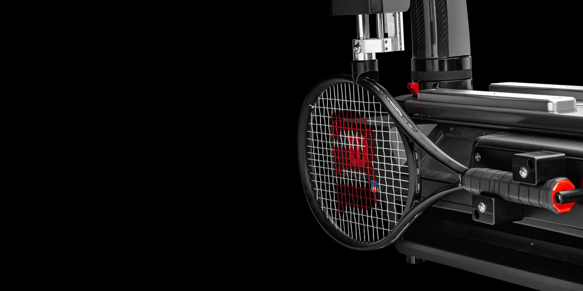Image of Wilson racket on Baiardo Stringing Machine, black background