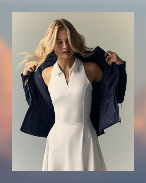 women in a white dress and navy jacket