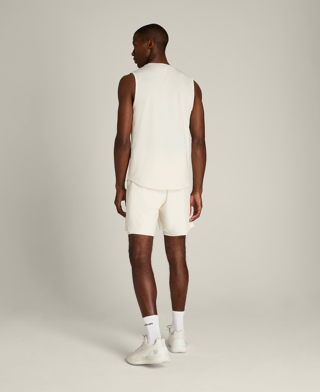 WM00443W002001_2_M_PEAK_UNLINED_TENNIS_SHORT_7IN_M_SANDRIFT