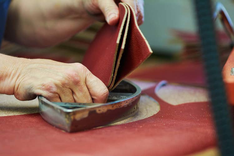 Cutting fabric of a NFL football