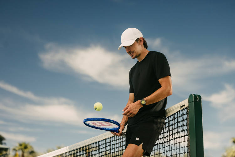 Alex de Minaur wearing Wilson tee and shorts