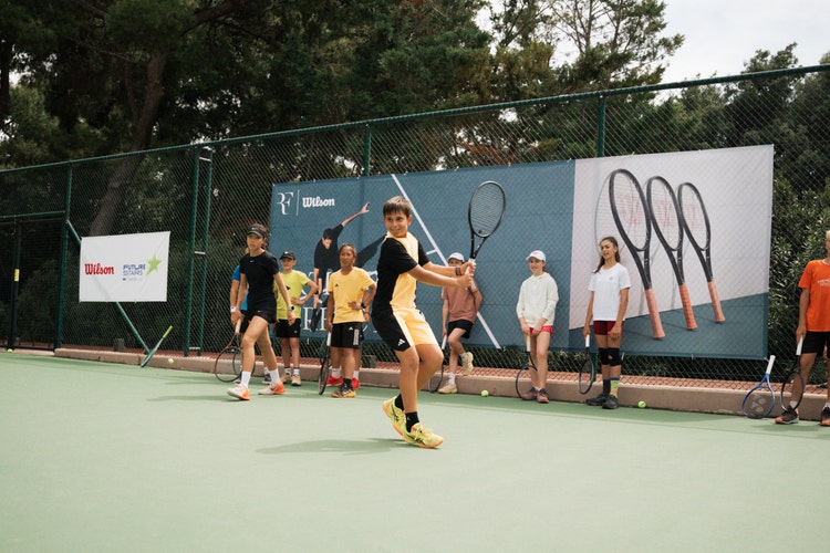 kid testing the RF 01 future tennis racket at Tatoi club