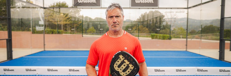 Miguel Sciorilli on a padel court holding a Wilson padel racket