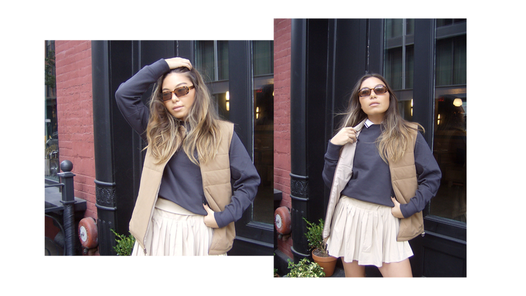 Model wearing a sweatshirt, vest, and tennis skirt to demonstrate "tenniscore" fashion aesthetic