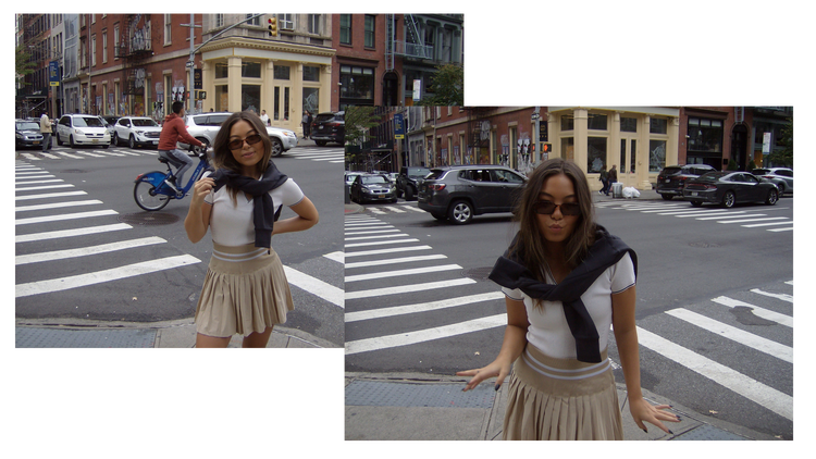 Model wearing a polo and tennis skirt, with a sweater draped on her shoulders.