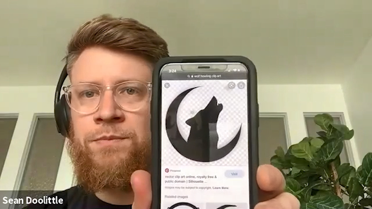 Sean Doolittle holding up a photo of wolf graphic