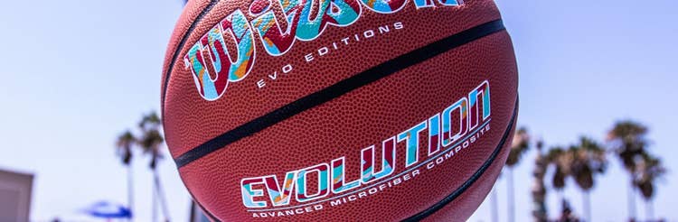 Two men compete in a 1v1 streetball tournament at Venice Beach
