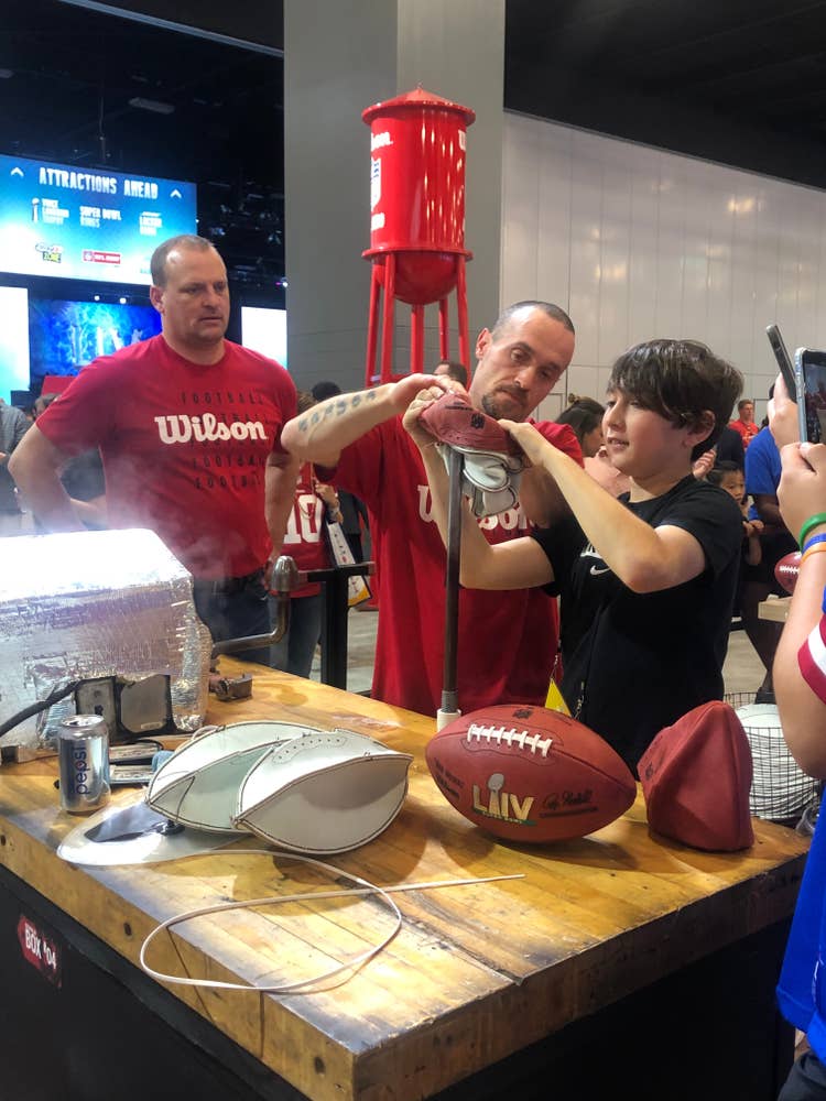 Jimmy Conley turning at football at SBLIV Fan Fest