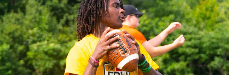 Player throwing a wilson football