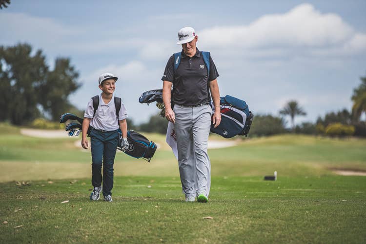 a father and son on the fairway