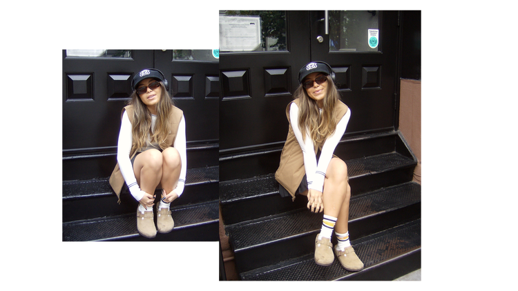 Model wearing a tennis skirt with a vest and birkenstocks to show a streetwear-inspired look