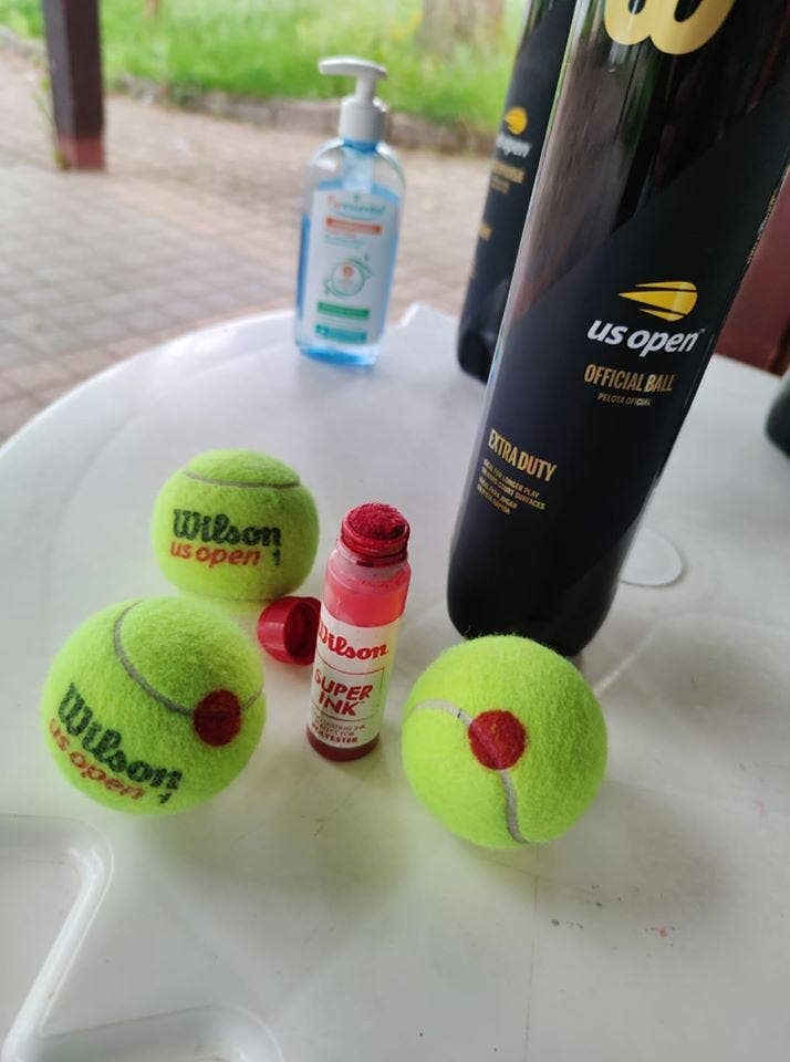Tennis balls marked with dots