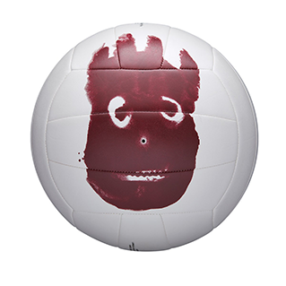 closeup of a white volleyball with a red handprint on it