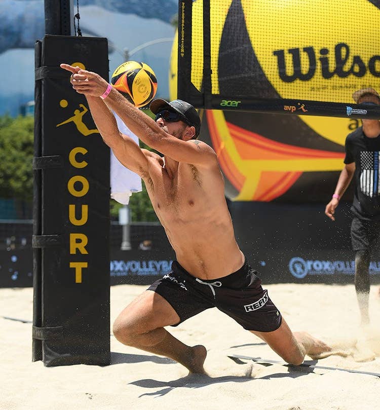 volleyball player diving for a save
