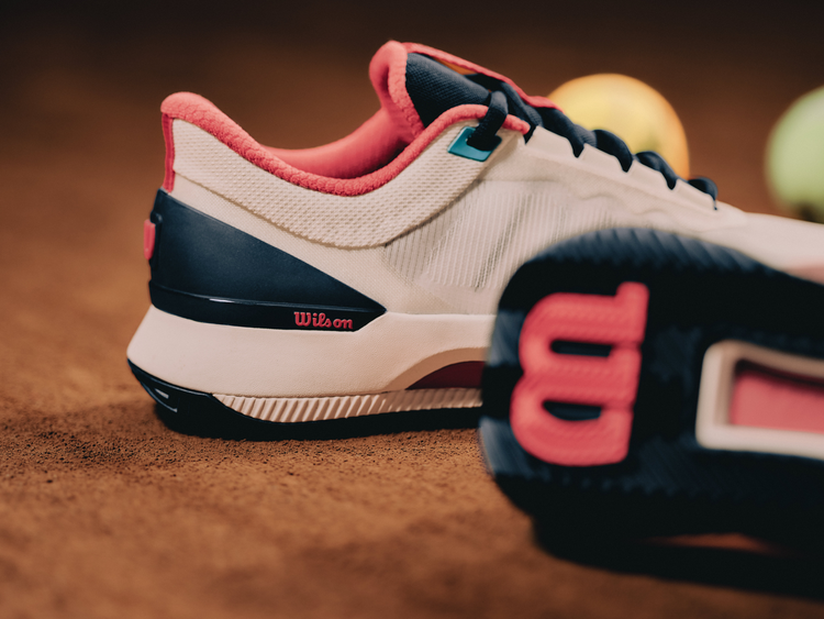 The Intrigue Tour tennis shoe on the court