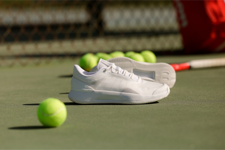 Wilson Intrigue women's tennis shoes on court