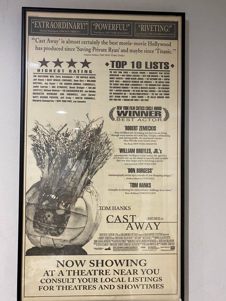 A framed Cast Away movie poster