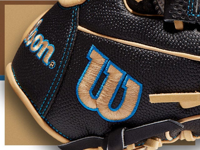 black baseball glove with Wilson logo in tan and blue stitching