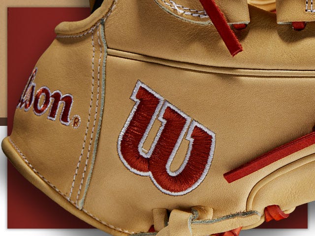 baseball glove with red-stitched Wilson logo