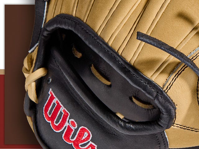 image showing back of baseball glove with hole and wilson logo