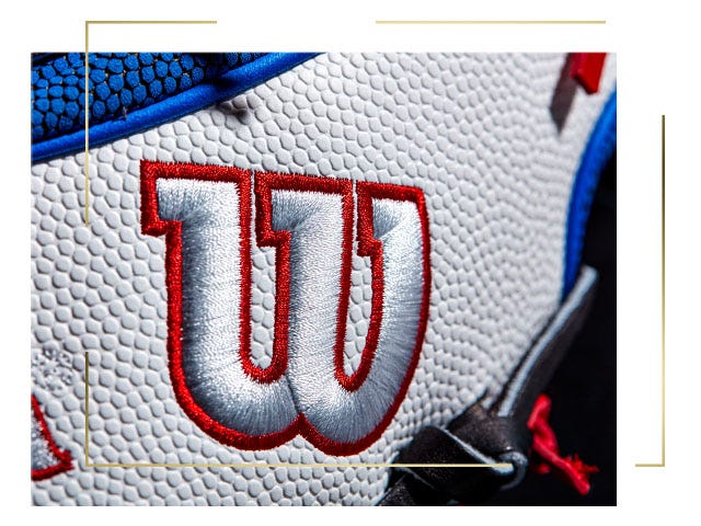 close up of white baseball glove with Red and white Wilson logo