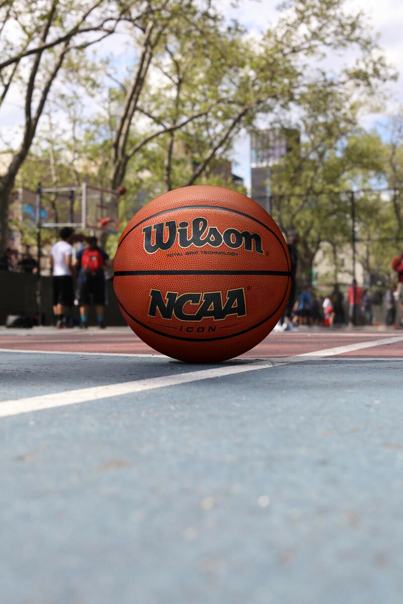 Wilson Evolution Basketball on a court Wilson Evolution Basketball on a court