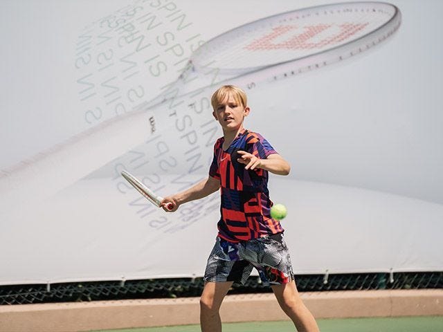 A junior playing with the Shift 99L tennis racket